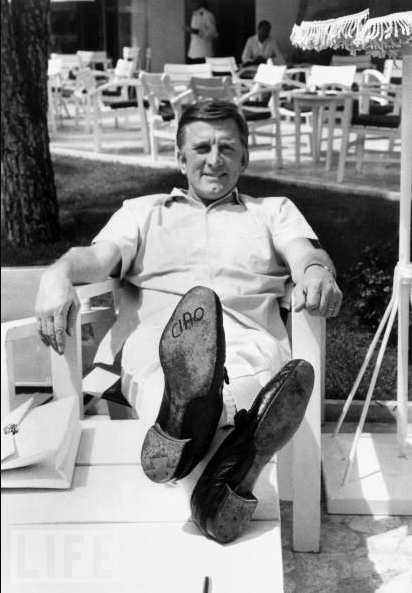 Kirk Douglas lets his feet do the talking on May 9, 1966. The word "ciao" ("hello" or "goodbye" in Italian) is written on the sole of his shoe.
