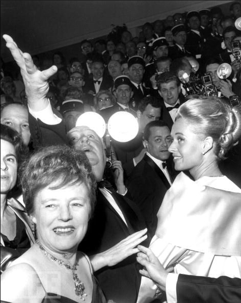 Alfred Hitchcock casts a spell at the Cannes Film Festival with his wife, Alma Reville, and actress Tippi Hedren to promote "The Birds" on May 11, 1963.