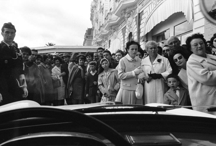 Waiting for a glimpse of movie stars, Cannes, 1962.