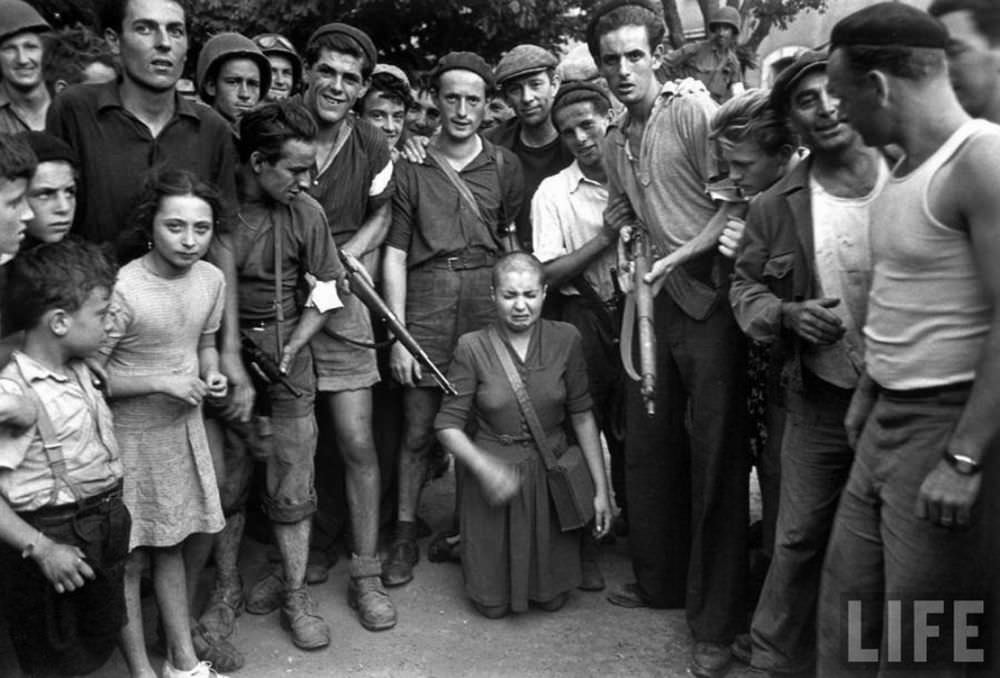 A French woman accused of sleeping with Germans is attacked and her head has been shaved by her neighbors in a village near Marseilles.