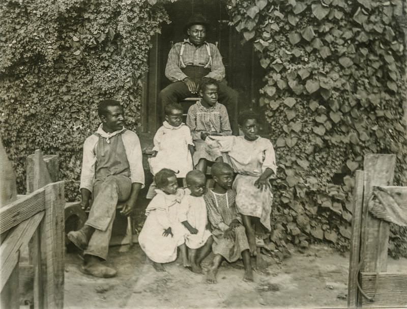 Family in front of house, Greenville, Texas