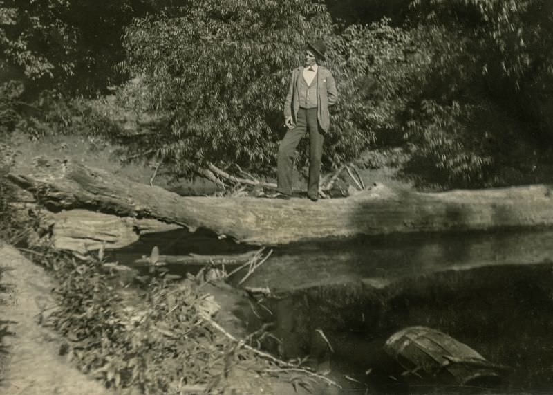 Man on a log, Greenville, Texas