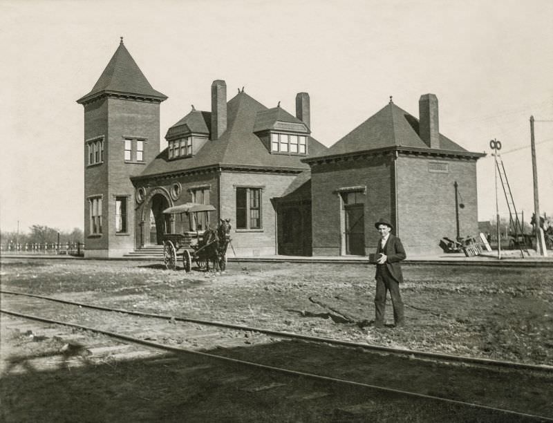 Railroad and horse wagon and man with a box camera, Greenville, Texas