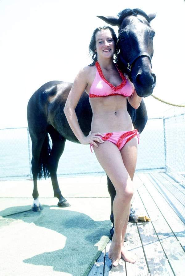 A diver poses for a photo with her horse in Atlantic City, 1977.