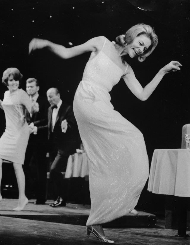 A stunning, happy Lauren Bacall performs an animated solo dance in a scene from her new Broadway hit, 'Cactus Flower,' 1965.