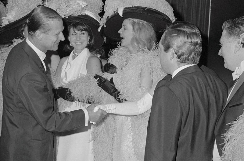 Prince Philip clasps hands with Lauren Bacall at the Americana Hotel, New York, March 1966.
