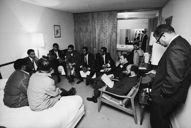 Stunned, silent members of the Southern Christian Leadership Conference in Dr. King's room at the Lorraine Motel, April 4, 1968.