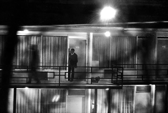 A photo taken through tree branches by Henry Groskinsky from a derelict building across the street from the Lorraine Motel, April 4, 1968, very close to where the shot that killed Dr. King likely came from.