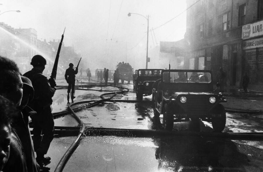 The Illinois National Guard patrol the riot-affected Westside of the city. Police said at least nine people were killed during the chaos, with over 343 arrested.