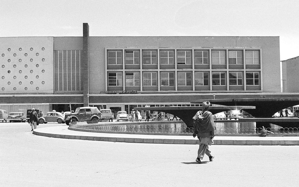 Modern new Finance Ministry building in Kabul, on June 9, 1966, with a public, western-style cafeteria and sidewalk restaurant, facing a water fountain which is illuminated in color at night. (AP Photo)