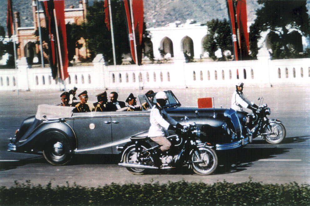 The King of Afghanistan, Mohammad Zahir Shah rides in his limousine on Kabul's central road Idga Wat in this 1968 photo.