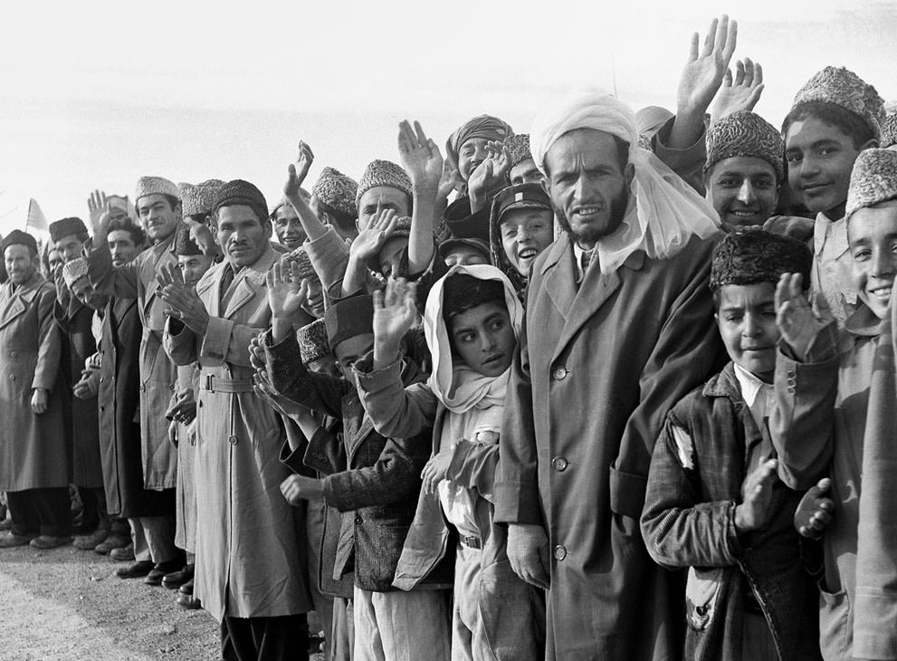 Residents of Afghanistan line the route of U.S. President Dwight Eisenhower's tour in Kabul, Afghanistan, on December 9, 1959.