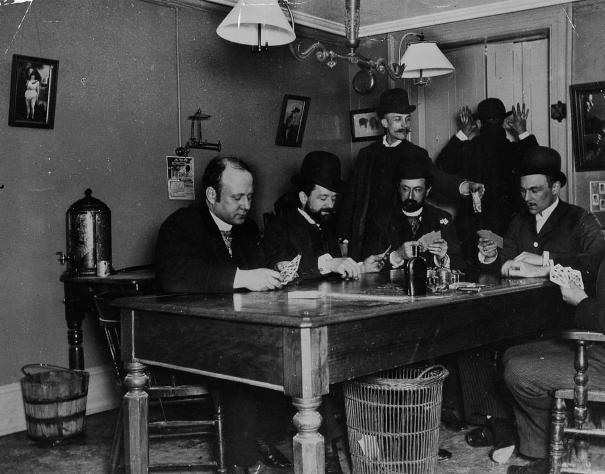 Men play cards in a New York building, 1890
