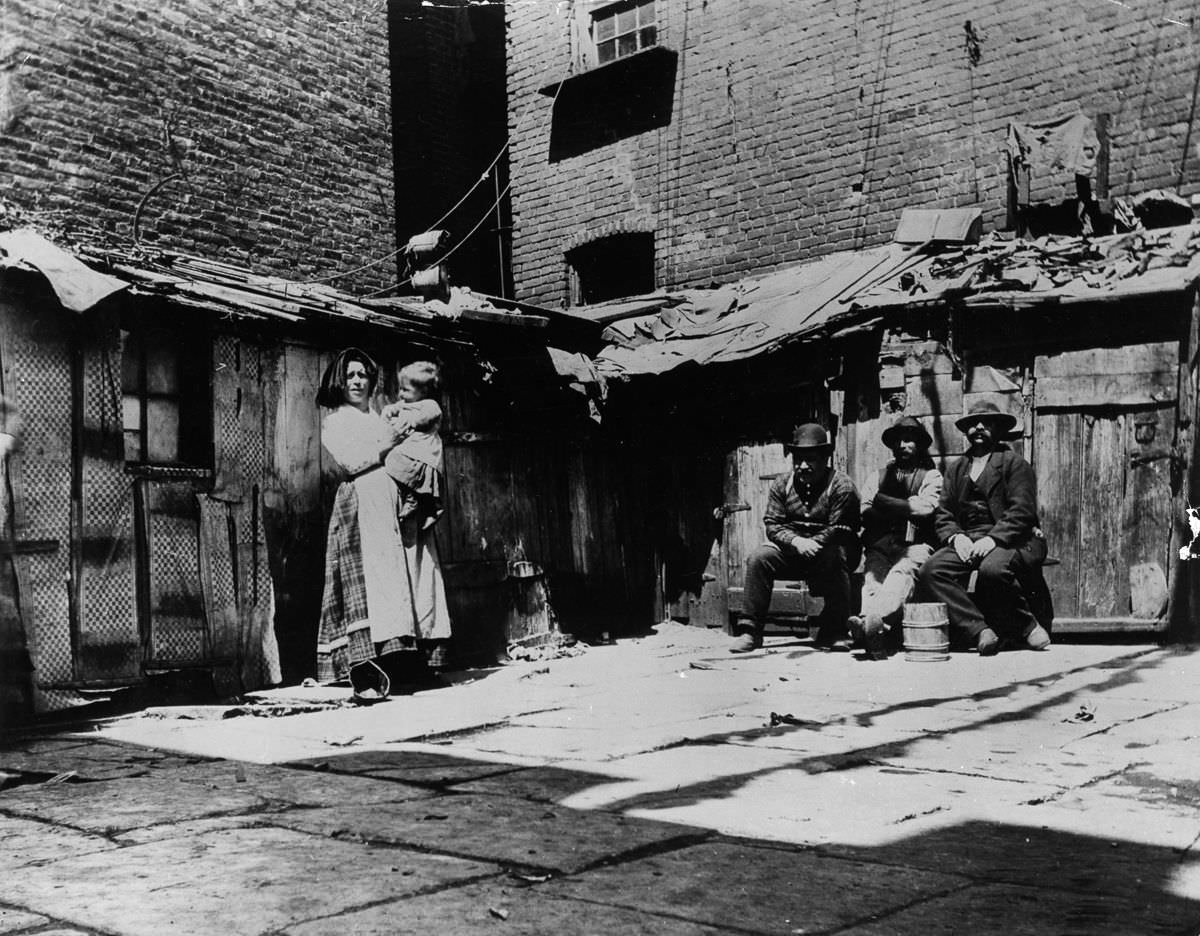 Italian immigrant families living in shacks on Jersey Street, 1897
