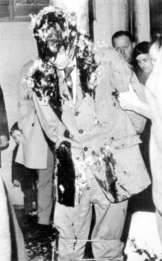 A youth tarred and feathered tied to a lamp post in the Falls Road area of Belfast. He is one of three who received such treatment in the past 24 hours. 10 Jan, 1971