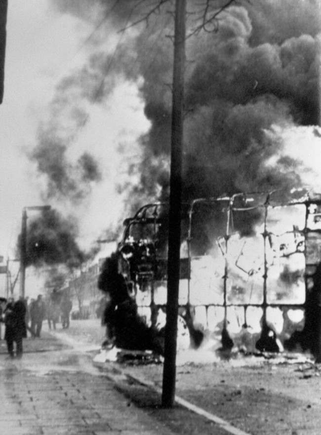 Flames leap into the air from a double decker bus when rioters used it as a blazing barricade in the Roman Catholic Falls Road area of Belfast. Violence broke out in Springfield Road after police and troops carried out an arms. 3 Feb, 1971