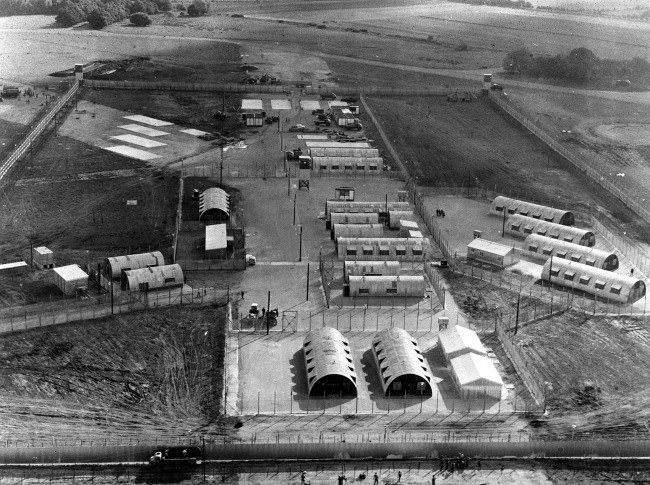 This former airfield is now the internment camp for IRA detainees. The hutments now have central heating and other modern amenities. The camp is called Long Kesh. The airfield was built 30 years ago and used by bombers taking off for Germany.