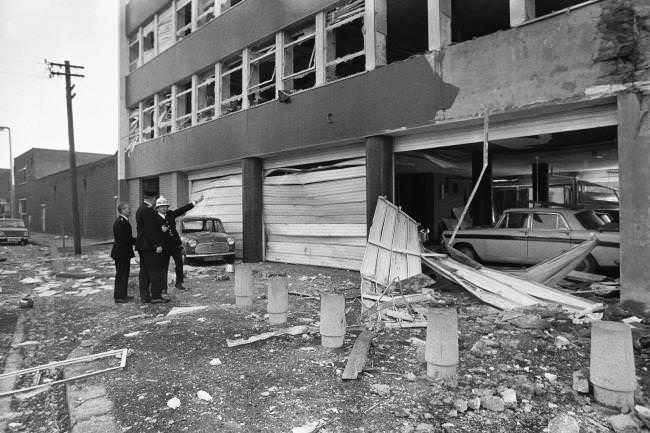 Security men examine the damage caused by a terrorist bomb detonated in the Youth Employment Office in Belfast, Northern Ireland on Nov. 2, 1971.