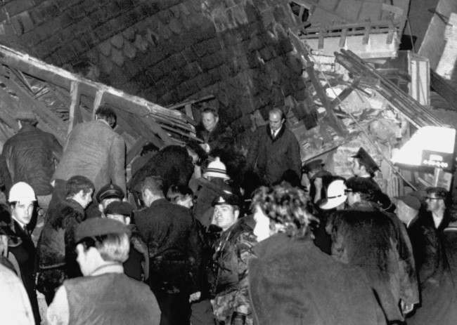 Rescuers search the wreckage of the Red Lion Bar in Belfast, Northern Ireland, where a terrorist bomb, killed two and injured over thirty persons on November 2, 1971.