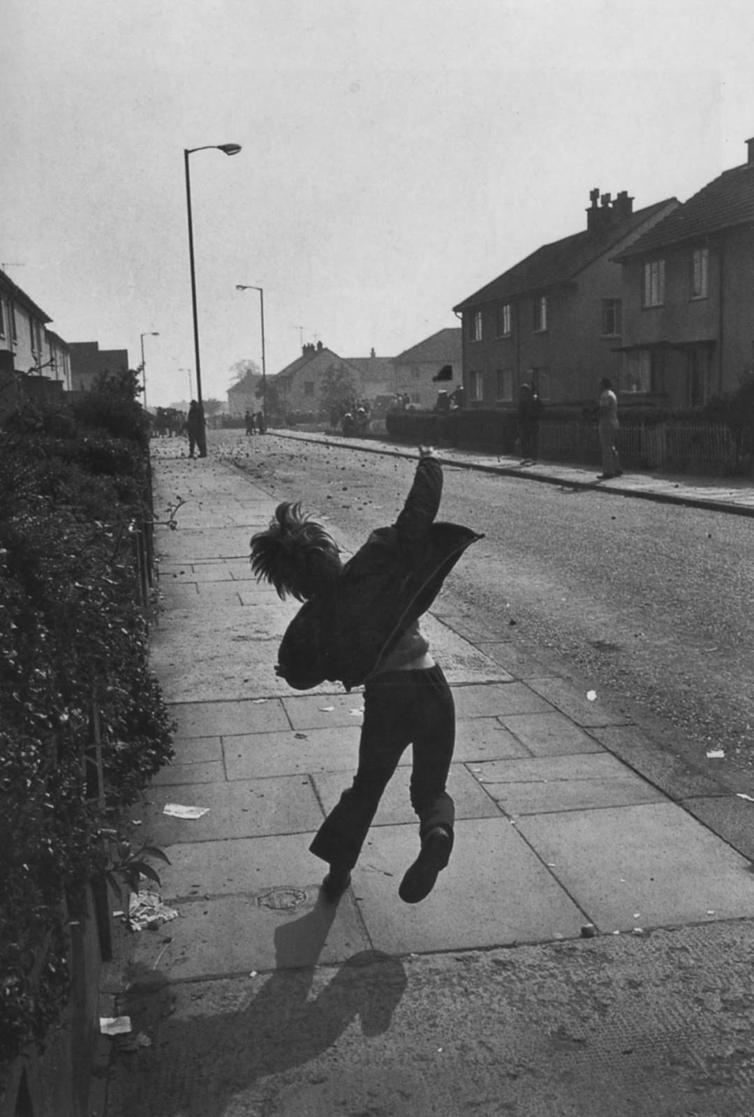 Boy throwing stones at British soldiers in Northern Ireland, 1971.