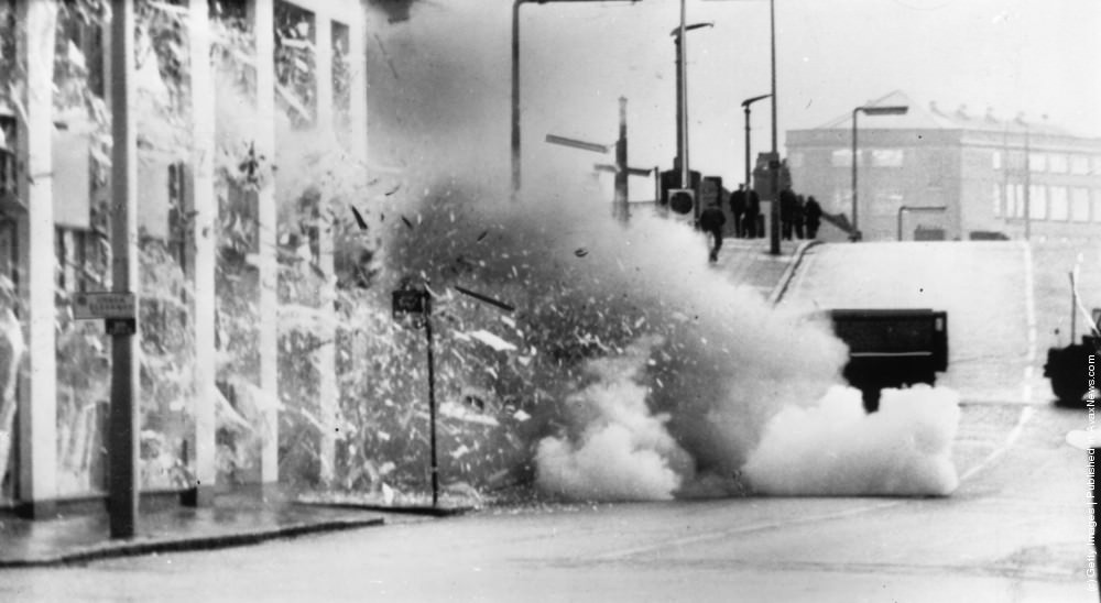 A car explodes after troops carried out a controlled explosion of a suspected bomb in Belfast, 17th November 1971.