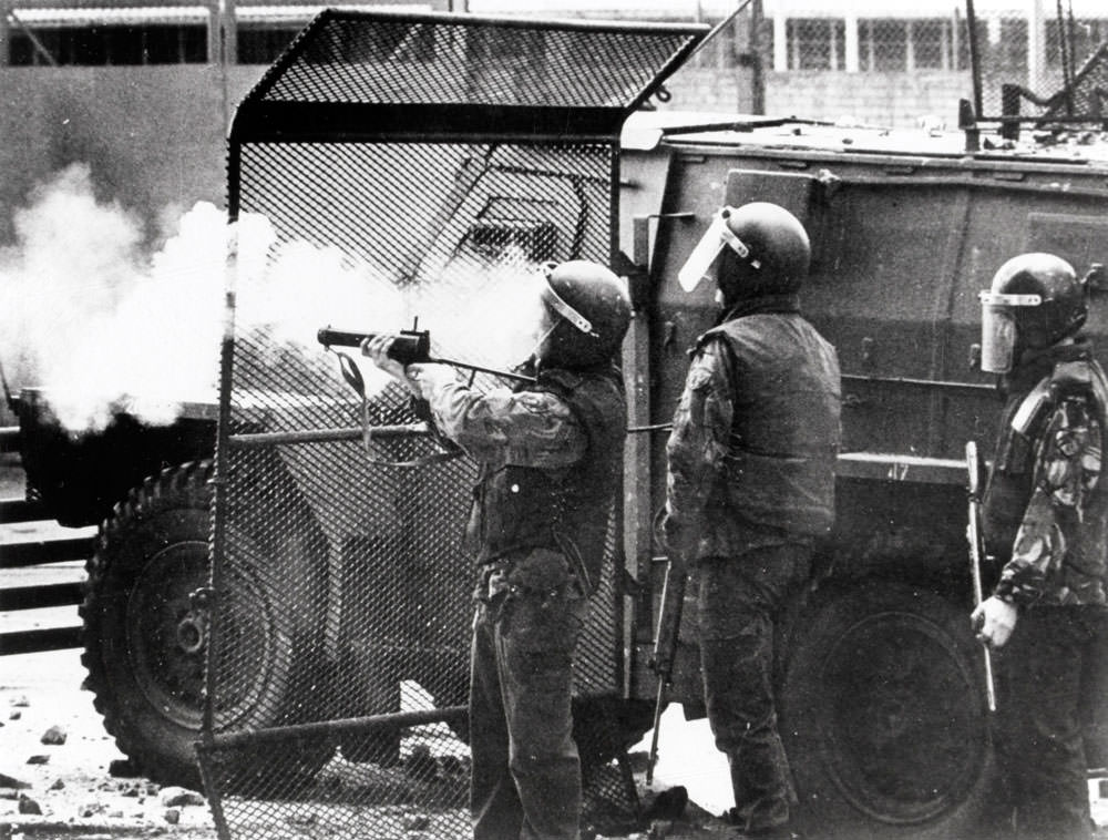 A soldier fires off a baton round, Northern Ireland, 1972.