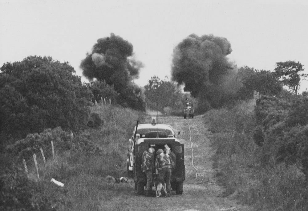 Members of 321 Explosive Ordnance Disposal Company, Royal Army Ordnance Corps, detonate a device near the Irish border, 1975.