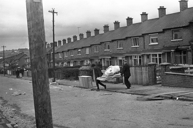 With the fear of being burnt out, Protestant householders move some of their belongings from a street in the Ardoyne area of Belfast, Northern Ireland on August 10, 1971.