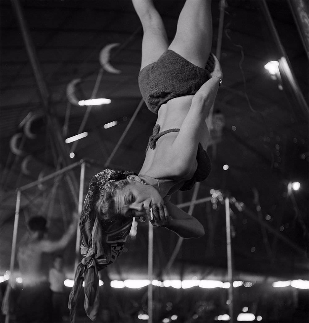 An aerialist smoking while rehearsing for the Ringling Bros. and Barnum & Bailey Circus in Sarasota, FL in 1949.