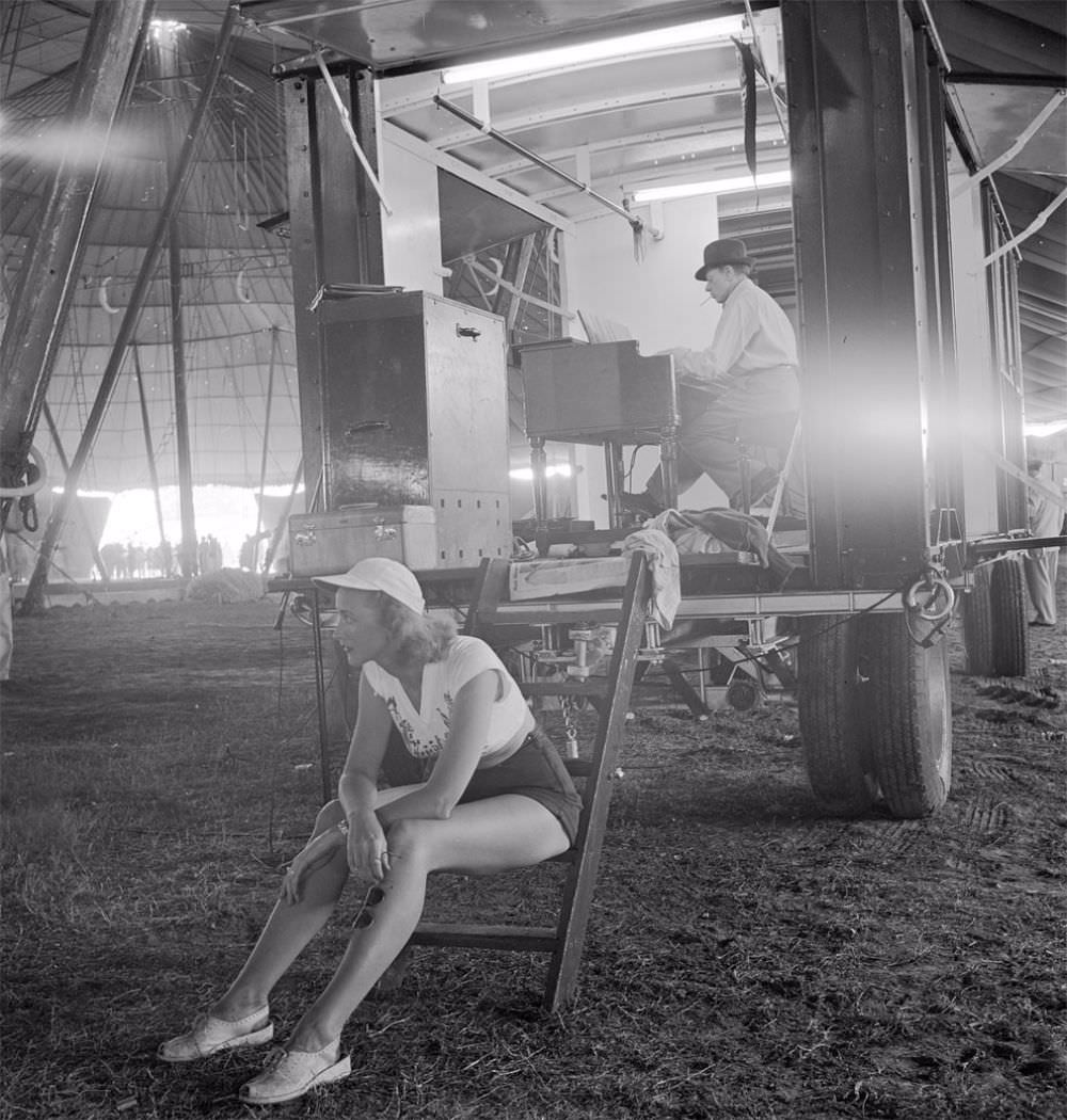 A circus girl sitting on a ladder during a rehearsal for the Ringling Bros. and Barnum & Bailey Circus in Sarasota, FL in 1949.