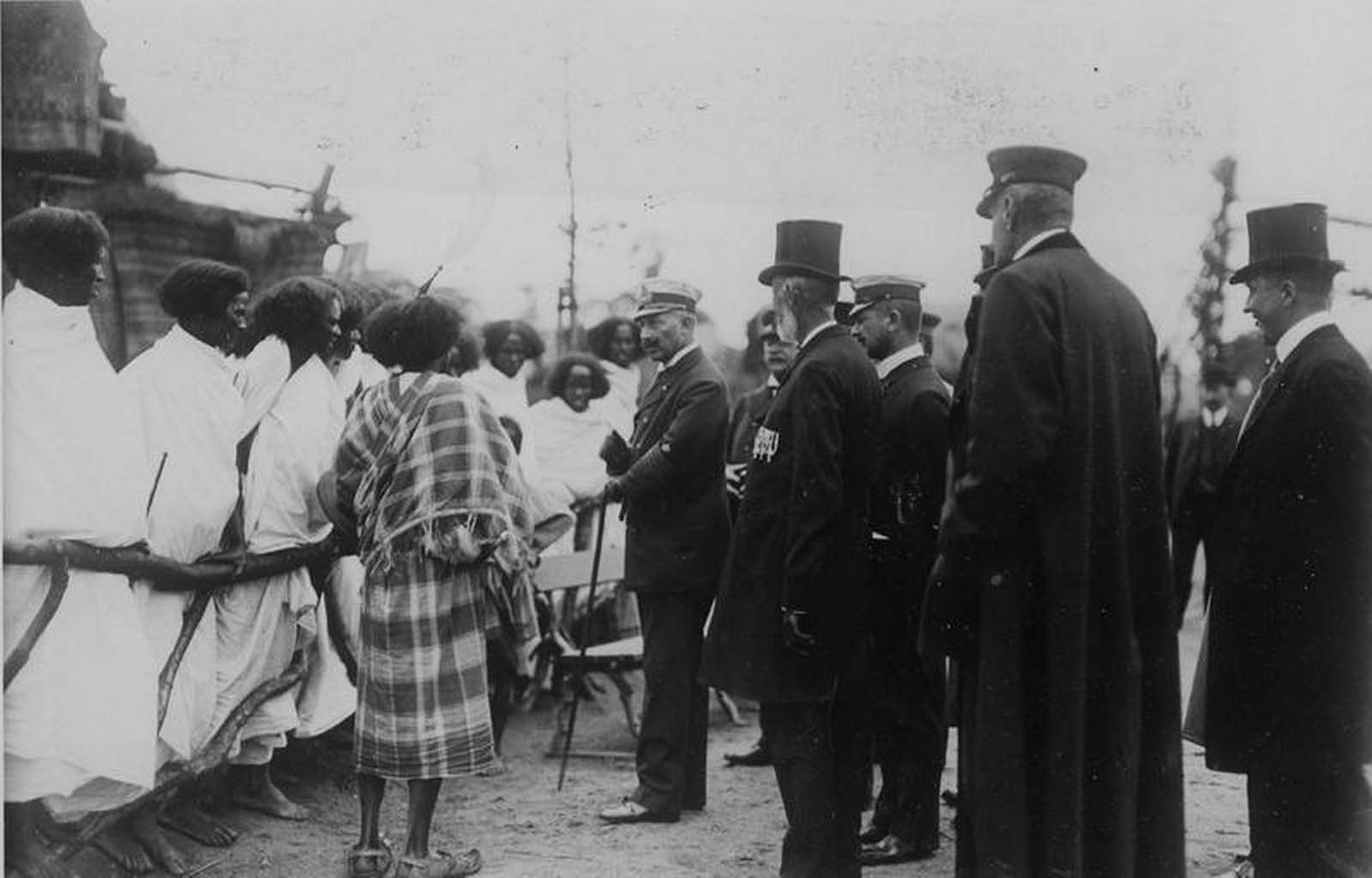 Germany’s Kaiser Wilhelm II is pictured meeting Ethiopians standing behind a wooden fence in Hamburg, Germany in 1909.