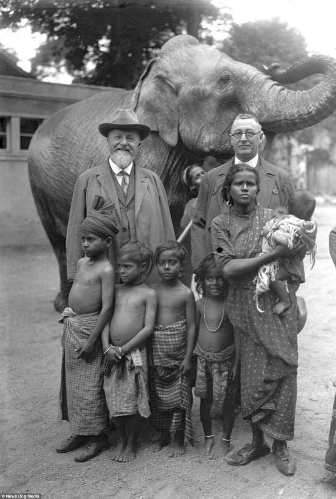 German zoologist Professor Lutz Heck (left) with an elephant and a family he brought to the Berlin Zoo, in Germany in 1931.