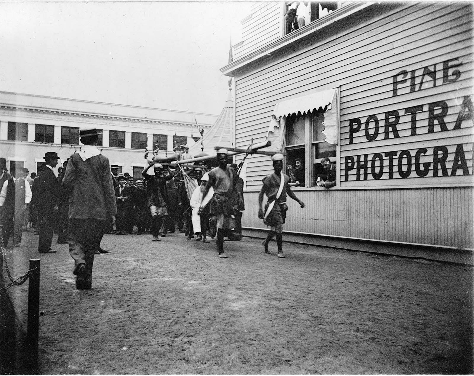 ‘Cannibals carrying their master’, natives performing an act at World’s Columbian Exposition, Chicago, Ill.” 1893.