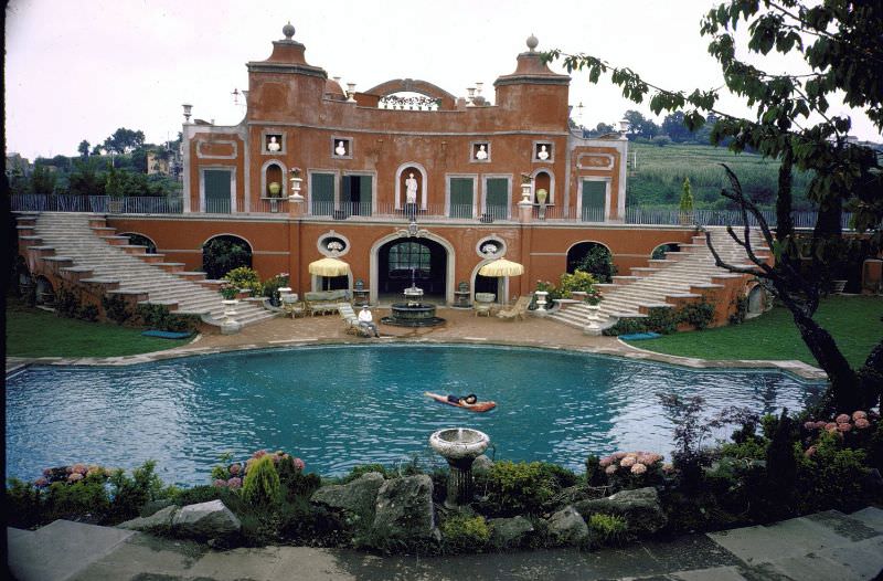 Sophia Loren swimming in the pool at her villa.