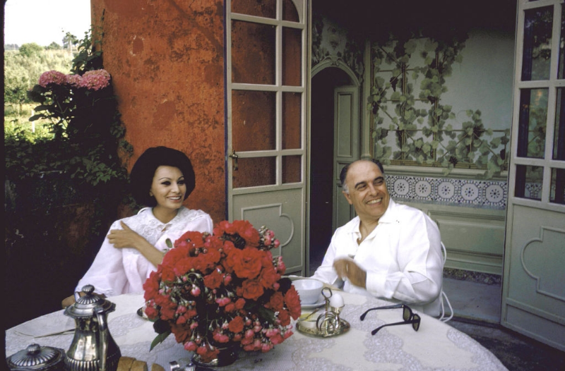 Sophia Loren and Carlo Ponti sitting on the terrace during breakfast.