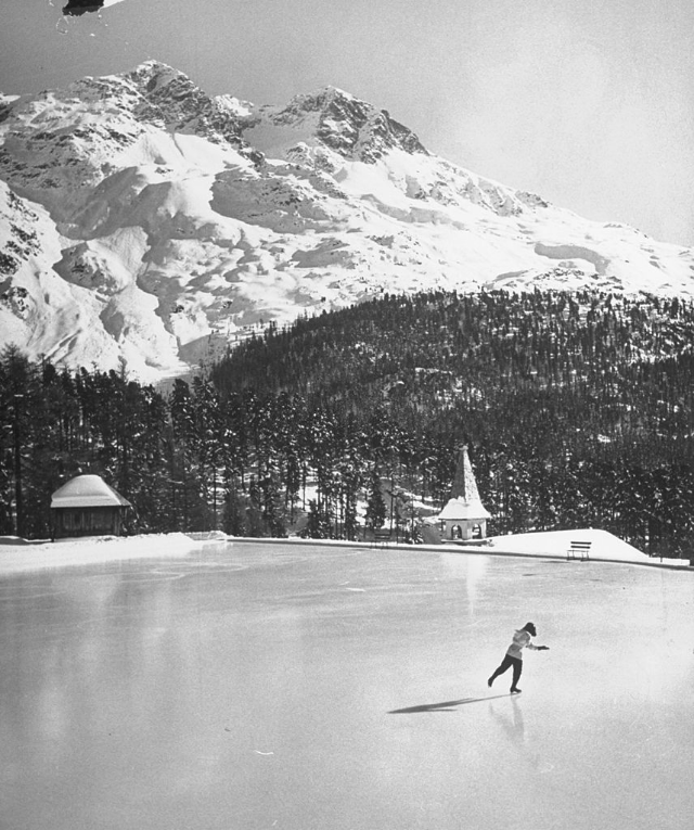 Skating on ice rink at Suvretta House, deluxe hotel in the Alps, three miles outside fashionable winter resort village of St. Moritz.