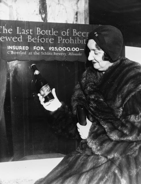 Rae Samuels holds the last bottle of beer that was distilled before Prohibition went into effect in Chicago, Dec. 29, 1930.