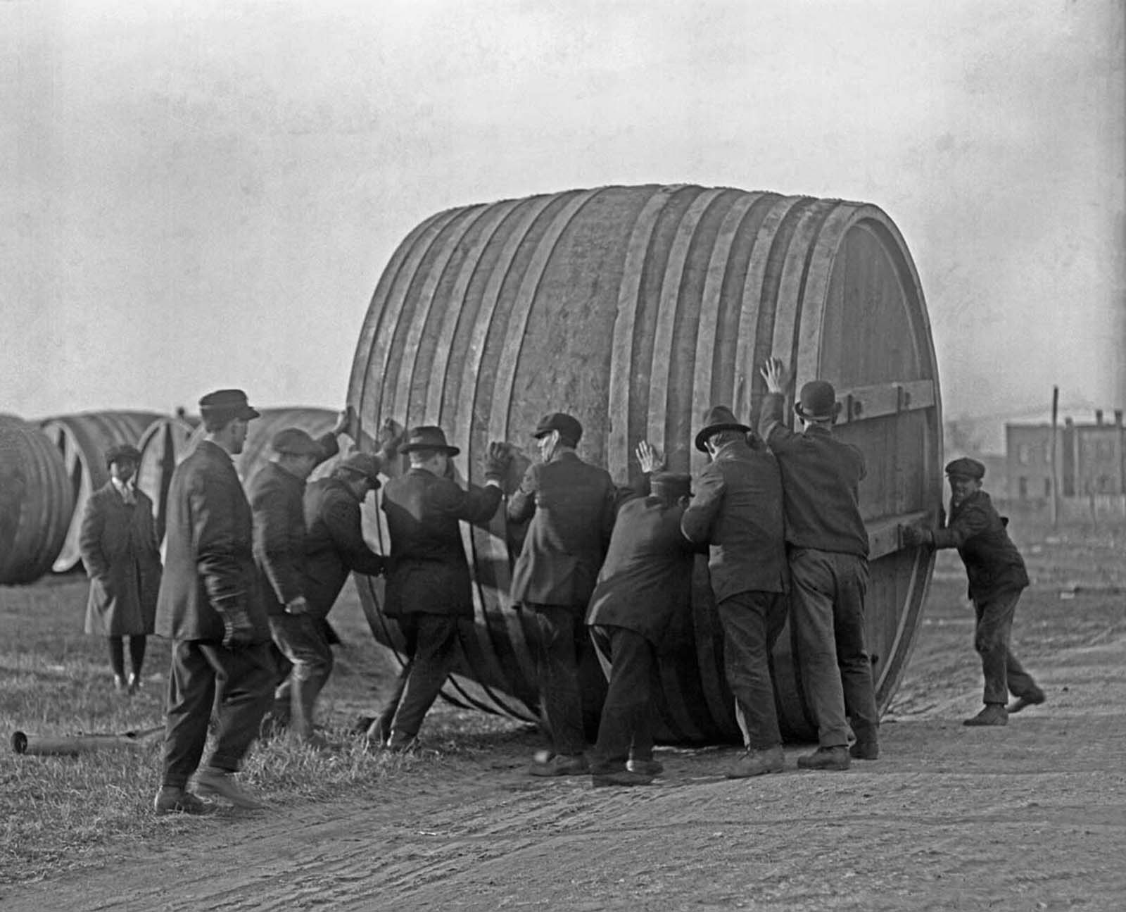 A brewery in Washington, DC, switches from brewing beer to making ice cream during Prohibition. Workers roll the giant beer vats out to make room for ice cream production equipment.
