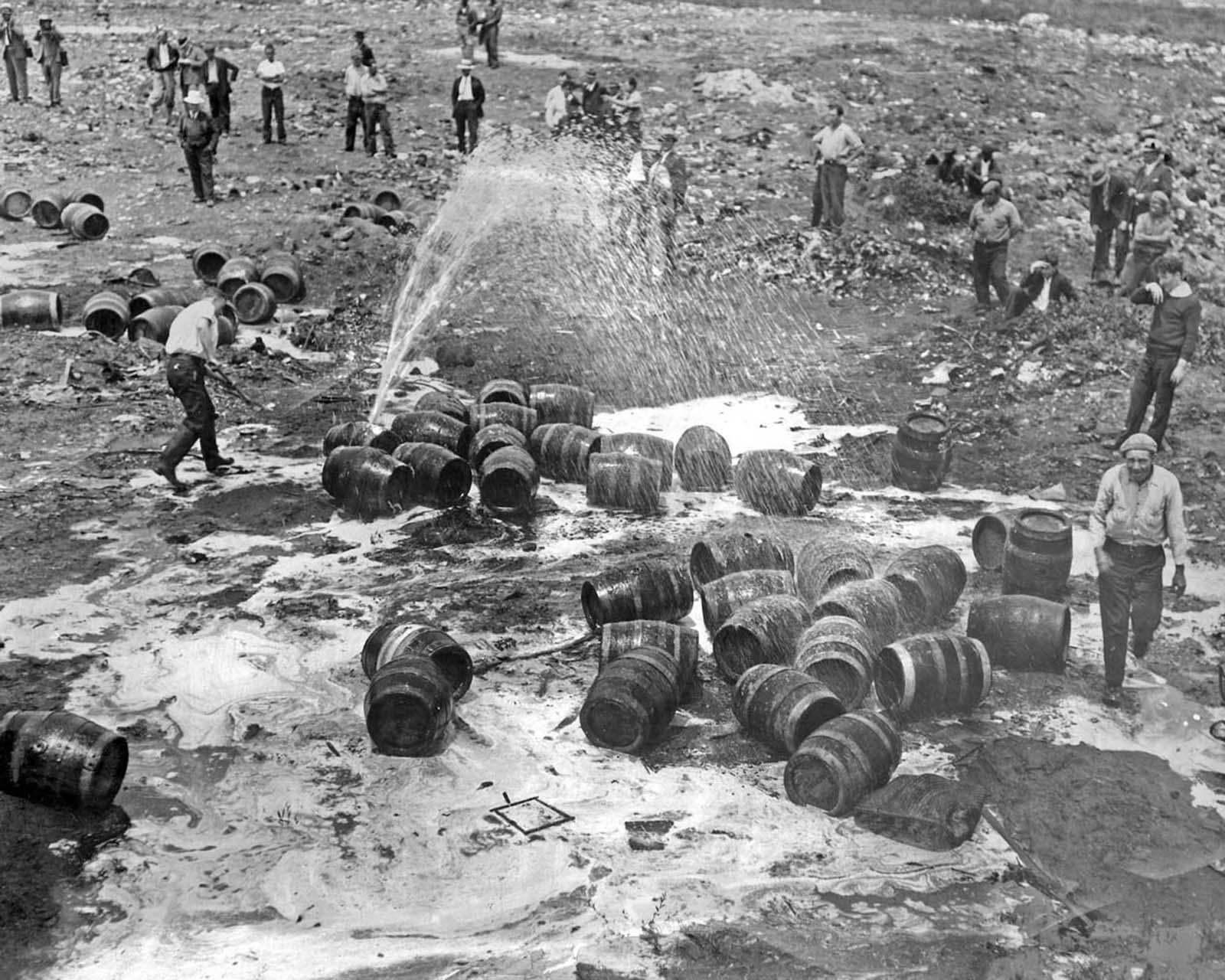 Prohibition agents destroy unlawful liquor seized in Hoboken.