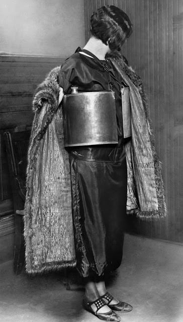 A woman arrested in Minneapolis on April 10, 1924. Her crime was “dispensing wet goods” from her bootlegger’s life preserver.