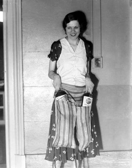 Estelle Zemon shows the vest and pant-apron used to conceal bottles of alcohol to deceive border guards during the U.S. alcohol prohibition on March 18, 1931.