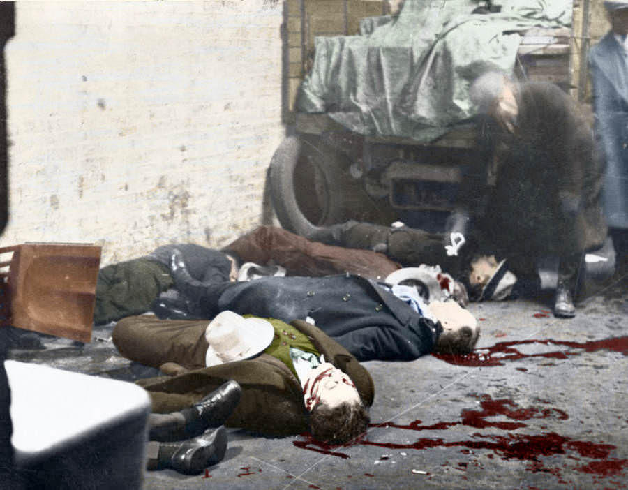 The Saint Valentine's Day Massacre, in which seven members of the North Side Gang were trapped in a garage, lined up against the wall, and shot to death by members of Al Capone's rival gang during a power struggle for control of Chicago, 1929.