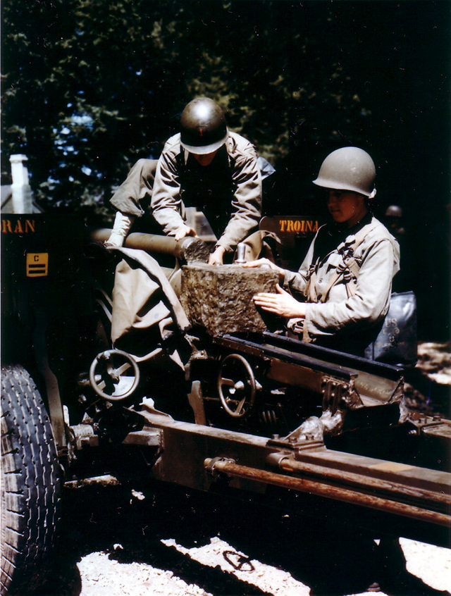 US Gunners prepare 76mm anti-tank gun (3 inch Gun M5) for transportation in preparation for Operation Overlord, June 1944