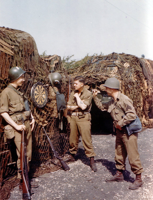US Soldiers playing darts, whilst waiting for loading on ships, before the beginning of Operation Overlord, England, June 1944