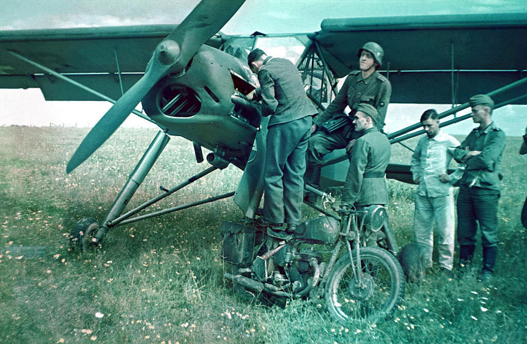 Servicing a Fieseler Fi 156 Storch also a captured British BSA M20 motorcycle