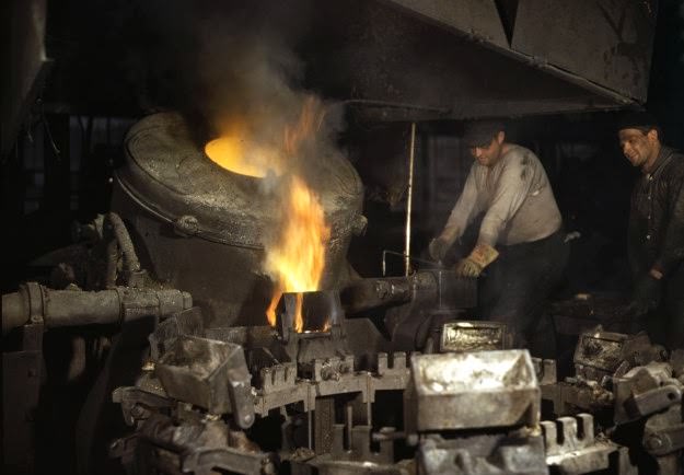 Casting a billet from an electric furnace, at Chase Brass and Copper Co., Euclid, Ohio. Modern electric furnaces have helped considerably in speeding the production of brass and other copper alloys for national defense.