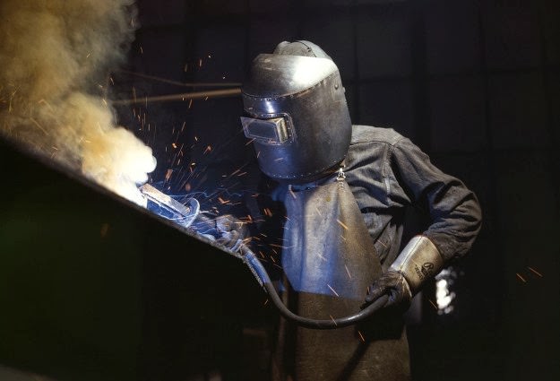 A welder making boilers for a ship, at Combustion Engineering Co., Chattanooga, Tennessee, in June of 1942