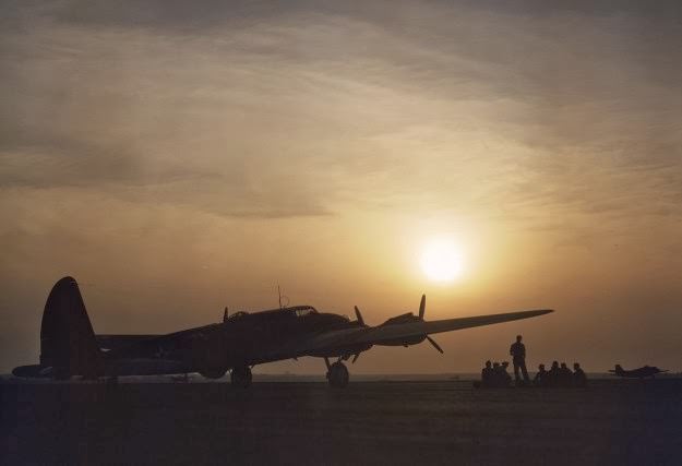 Sunset silhouette of a flying fortress, at Langley Field, Virginia, in July, 1942