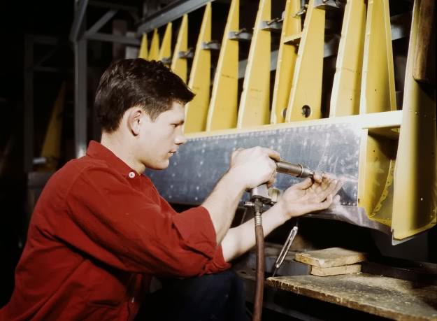 A riveter at work at the Douglas Aircraft Corporation plant in Long Beach, California, in October, 1942