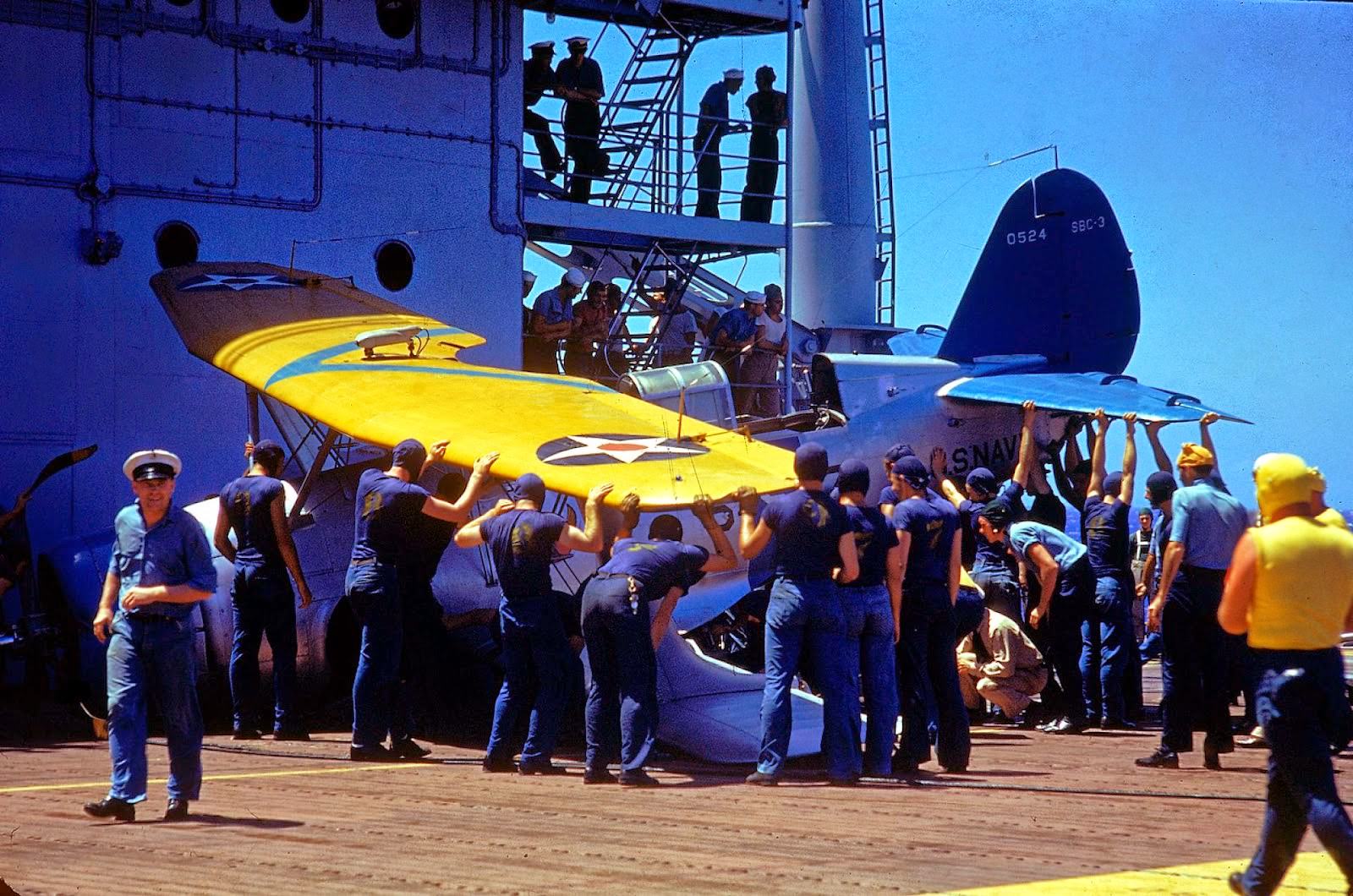 Crew removing plane which has made a slight crash landing aboard the aircraft carrier Enterprise CV-6 during the US Navy's Pacific Fleet maneuvers in 1940.